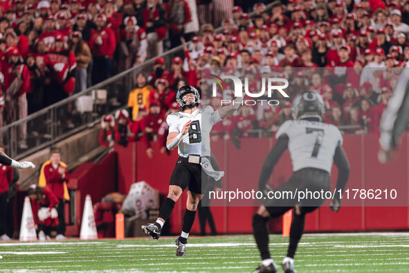 Oregon quarterback Dillon Gabriel #8 throws a pass downfield against the Wisconsin Badgers at Camp Randall Stadium in Madison, Wisconsin, on...