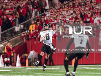 Oregon quarterback Dillon Gabriel #8 throws a pass downfield against the Wisconsin Badgers at Camp Randall Stadium in Madison, Wisconsin, on...