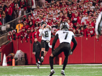 Oregon quarterback Dillon Gabriel #8 throws a pass downfield against the Wisconsin Badgers at Camp Randall Stadium in Madison, Wisconsin, on...