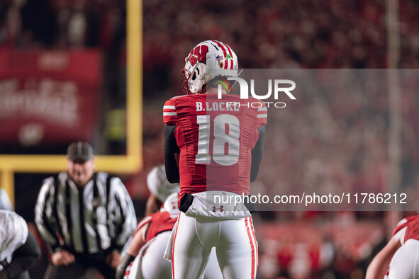 Wisconsin Badgers quarterback Braedyn Locke #18 eyes the Oregon Ducks defense before the snap at Camp Randall Stadium in Madison, Wisconsin,...