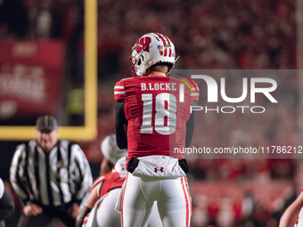 Wisconsin Badgers quarterback Braedyn Locke #18 eyes the Oregon Ducks defense before the snap at Camp Randall Stadium in Madison, Wisconsin,...