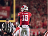 Wisconsin Badgers quarterback Braedyn Locke #18 eyes the Oregon Ducks defense before the snap at Camp Randall Stadium in Madison, Wisconsin,...