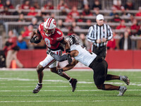 Wisconsin Badgers wide receiver Vinny Anthony II #8 tries to escape a tackle against the Oregon Ducks at Camp Randall Stadium in Madison, Wi...