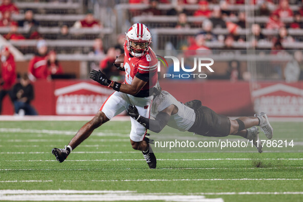 Wisconsin Badgers wide receiver Vinny Anthony II #8 tries to escape a tackle against the Oregon Ducks at Camp Randall Stadium in Madison, Wi...