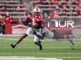 Wisconsin Badgers wide receiver Vinny Anthony II #8 tries to escape a tackle against the Oregon Ducks at Camp Randall Stadium in Madison, Wi...