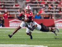 Wisconsin Badgers wide receiver Vinny Anthony II #8 tries to escape a tackle against the Oregon Ducks at Camp Randall Stadium in Madison, Wi...