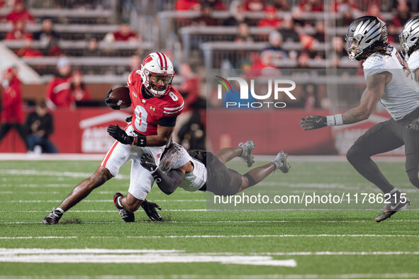 Wisconsin Badgers wide receiver Vinny Anthony II #8 tries to escape a tackle against the Oregon Ducks at Camp Randall Stadium in Madison, Wi...