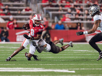 Wisconsin Badgers wide receiver Vinny Anthony II #8 tries to escape a tackle against the Oregon Ducks at Camp Randall Stadium in Madison, Wi...