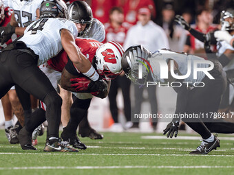 Wisconsin Badgers running back Tawee Walker #3 finds the hole against the Oregon Ducks defense at Camp Randall Stadium in Madison, Wisconsin...