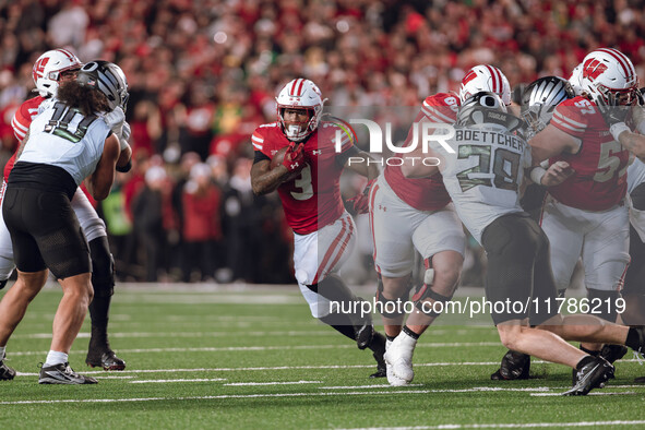 Wisconsin Badgers running back Tawee Walker #3 finds the hole against the Oregon Ducks defense at Camp Randall Stadium in Madison, Wisconsin...