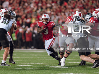 Wisconsin Badgers running back Tawee Walker #3 finds the hole against the Oregon Ducks defense at Camp Randall Stadium in Madison, Wisconsin...