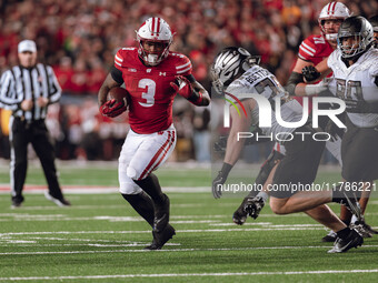 Wisconsin Badgers running back Tawee Walker #3 finds the hole against the Oregon Ducks defense at Camp Randall Stadium in Madison, Wisconsin...