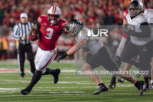 Wisconsin Badgers running back Tawee Walker #3 finds the hole against the Oregon Ducks defense at Camp Randall Stadium in Madison, Wisconsin...