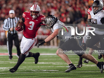 Wisconsin Badgers running back Tawee Walker #3 finds the hole against the Oregon Ducks defense at Camp Randall Stadium in Madison, Wisconsin...