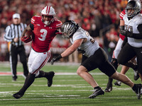 Wisconsin Badgers running back Tawee Walker #3 finds the hole against the Oregon Ducks defense at Camp Randall Stadium in Madison, Wisconsin...