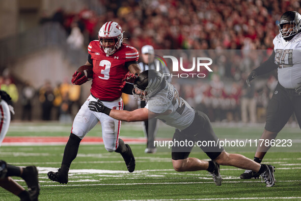 Wisconsin Badgers running back Tawee Walker #3 finds the hole against the Oregon Ducks defense at Camp Randall Stadium in Madison, Wisconsin...