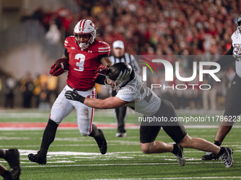 Wisconsin Badgers running back Tawee Walker #3 finds the hole against the Oregon Ducks defense at Camp Randall Stadium in Madison, Wisconsin...