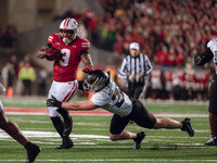 Wisconsin Badgers running back Tawee Walker #3 finds the hole against the Oregon Ducks defense at Camp Randall Stadium in Madison, Wisconsin...