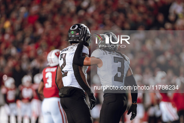 Oregon defensive back Brandon Johnson #3 and Oregon inside linebacker Jeffrey Bassa #2 celebrate after a defensive stop against the Wisconsi...