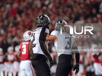 Oregon defensive back Brandon Johnson #3 and Oregon inside linebacker Jeffrey Bassa #2 celebrate after a defensive stop against the Wisconsi...