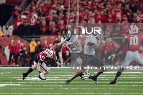 Oregon tight end Terrance Ferguson #3 attempts to break free from the Wisconsin Badgers defense at Camp Randall Stadium in Madison, Wisconsi...