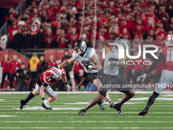 Oregon tight end Terrance Ferguson #3 attempts to break free from the Wisconsin Badgers defense at Camp Randall Stadium in Madison, Wisconsi...