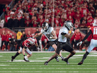 Oregon tight end Terrance Ferguson #3 attempts to break free from the Wisconsin Badgers defense at Camp Randall Stadium in Madison, Wisconsi...