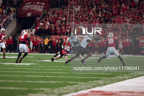 Oregon tight end Terrance Ferguson #3 attempts to break free from the Wisconsin Badgers defense at Camp Randall Stadium in Madison, Wisconsi...