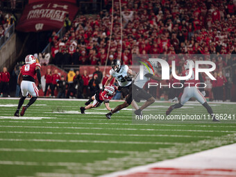 Oregon tight end Terrance Ferguson #3 attempts to break free from the Wisconsin Badgers defense at Camp Randall Stadium in Madison, Wisconsi...