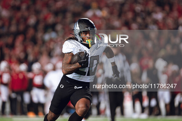 Oregon running back Jordan James #20 finds an opening on the edge for a touchdown against the Wisconsin Badgers at Camp Randall Stadium in M...