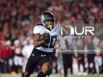 Oregon running back Jordan James #20 finds an opening on the edge for a touchdown against the Wisconsin Badgers at Camp Randall Stadium in M...