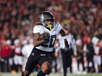 Oregon running back Jordan James #20 finds an opening on the edge for a touchdown against the Wisconsin Badgers at Camp Randall Stadium in M...