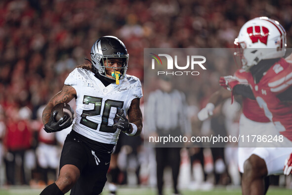 Oregon running back Jordan James #20 finds an opening on the edge for a touchdown against the Wisconsin Badgers at Camp Randall Stadium in M...