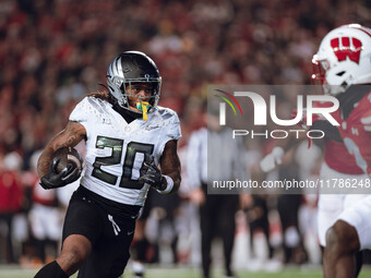 Oregon running back Jordan James #20 finds an opening on the edge for a touchdown against the Wisconsin Badgers at Camp Randall Stadium in M...