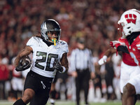 Oregon running back Jordan James #20 finds an opening on the edge for a touchdown against the Wisconsin Badgers at Camp Randall Stadium in M...