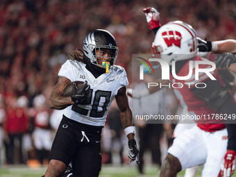 Oregon running back Jordan James #20 finds an opening on the edge for a touchdown against the Wisconsin Badgers at Camp Randall Stadium in M...