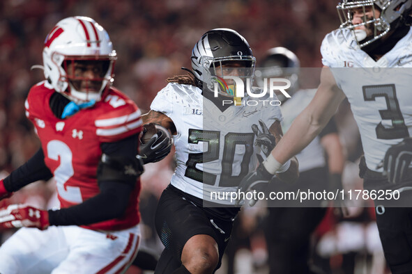 Oregon running back Jordan James #20 finds an opening on the edge for a touchdown against the Wisconsin Badgers at Camp Randall Stadium in M...