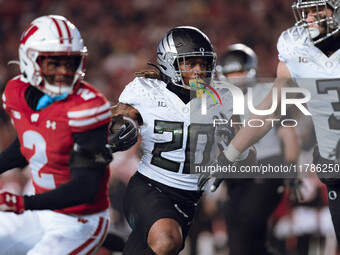 Oregon running back Jordan James #20 finds an opening on the edge for a touchdown against the Wisconsin Badgers at Camp Randall Stadium in M...