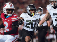 Oregon running back Jordan James #20 finds an opening on the edge for a touchdown against the Wisconsin Badgers at Camp Randall Stadium in M...