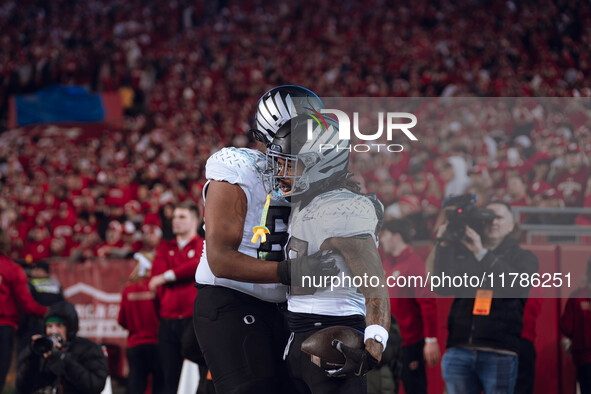 Oregon running back Jordan James #20 finds an opening on the edge for a touchdown against the Wisconsin Badgers at Camp Randall Stadium in M...