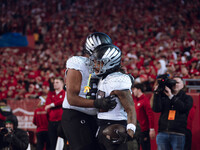 Oregon running back Jordan James #20 finds an opening on the edge for a touchdown against the Wisconsin Badgers at Camp Randall Stadium in M...