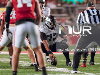 Oregon offensive lineman Matthew Bedford #77 communicates before the snap against the Wisconsin Badgers at Camp Randall Stadium in Madison,...