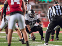 Oregon offensive lineman Matthew Bedford #77 communicates before the snap against the Wisconsin Badgers at Camp Randall Stadium in Madison,...