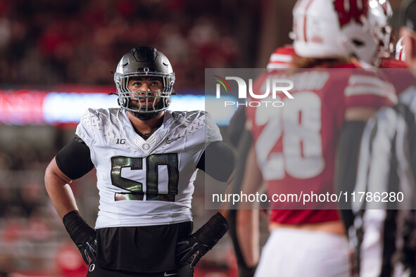 Oregon offensive lineman Nishad Strother #50 looks up at the clock in the 4th quarter against the Wisconsin Badgers at Camp Randall Stadium...