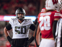 Oregon offensive lineman Nishad Strother #50 looks up at the clock in the 4th quarter against the Wisconsin Badgers at Camp Randall Stadium...