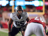 Oregon offensive lineman Marcus Harper II #55 looks at the Wisconsin Badgers defense before the snap at Camp Randall Stadium in Madison, Wis...