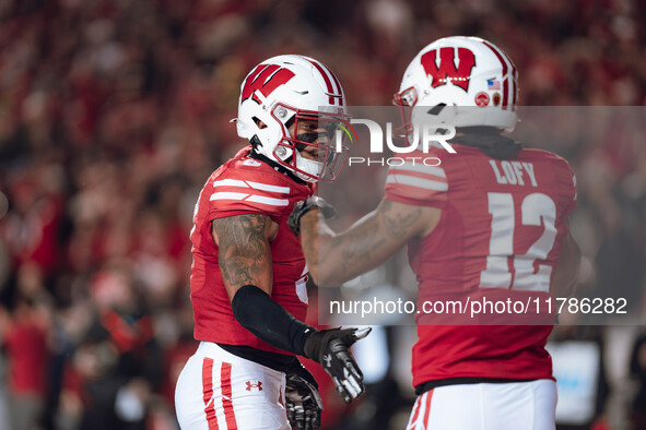 Wisconsin Badgers cornerback Max Lofy #12 and Wisconsin Badgers cornerback RJ Delancy III #5 celebrate after a play against the Oregon Ducks...