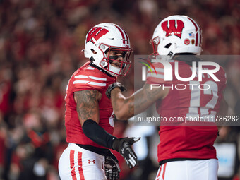 Wisconsin Badgers cornerback Max Lofy #12 and Wisconsin Badgers cornerback RJ Delancy III #5 celebrate after a play against the Oregon Ducks...