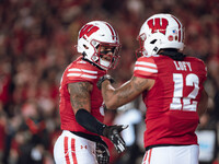 Wisconsin Badgers cornerback Max Lofy #12 and Wisconsin Badgers cornerback RJ Delancy III #5 celebrate after a play against the Oregon Ducks...