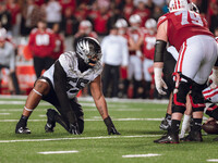 Oregon defensive lineman Derrick Harmon #55 stands in a stance before the snap against the Wisconsin Badgers at Camp Randall Stadium in Madi...